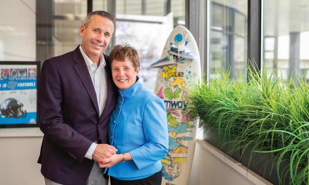 Jim and Nancy Ayers stand holding hands